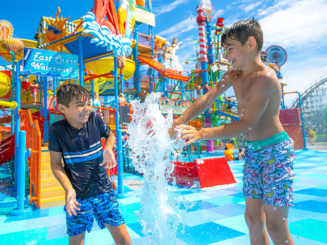 Two boys splashing at The Boardwalk at Hersheypark